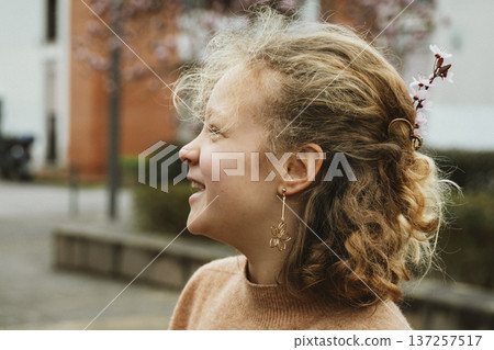 Laughing Girl with Cherry Blossoms in Her Hair 137257517