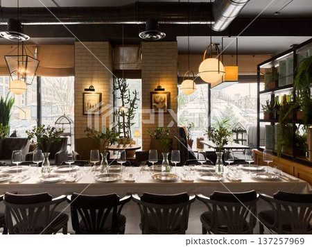 Intimate restaurant scene featuring warm tones and soft illumination 137257969