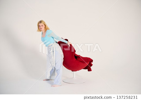 Woman in blue top and lace skirt exudes effortless glamour 137258231