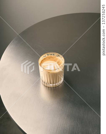 Upscale cafe scene with warm beverage and sleek surface 137258245
