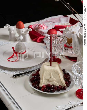 Family celebration featuring colorful eggs and decorative ornaments Family celebration featuring colorful eggs and decorative ornaments 137258248