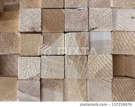 Stack of square wooden timber blocks. Natural wood end grain texture background. Stack of square wooden timber blocks. Natural wood end grain texture background. 137258976