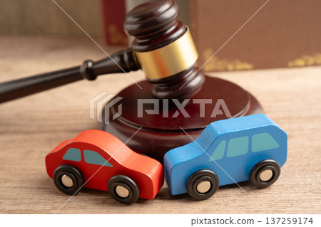 Car accident lawsuit and insurance, Judge hammer with car model. 137259174
