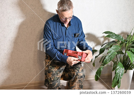 using electric drilling on wooden board using electric drilling on wooden board 137260039