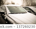 Heated glass on a modern snow-covered car. High quality photo 137260230