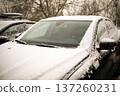 Heated glass on a modern snow-covered car. High quality photo 137260231