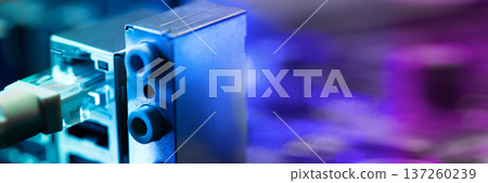 Fiber optic cables connected to optical ports and network cables connected to internet ports. High quality photo Fiber optic cables connected to optical ports and network cables connected to internet ports. High quality photo 137260239