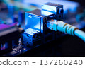 Fiber optic cables connected to optical ports and network cables connected to internet ports. High quality photo 137260240