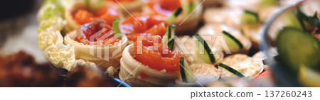 Tartlets with salmon on the festive table. High quality photo Tartlets with salmon on the festive table. High quality photo 137260243