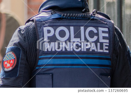 France, Toulouse, municipal police officer seen from behind 137260695