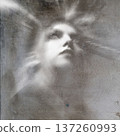 Woman's ethereal face emerging from abstract light rays 137260993