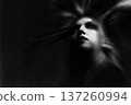 Woman's ethereal spirit rising in dark monochrome 137260994