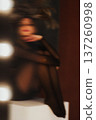 Woman with abstract motion blur effect sitting 137260998