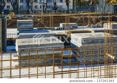 Reinforced Concrete Foundation and Rebar Framework at Urban Construction Site Reinforced Concrete Foundation and Rebar Framework at Urban Construction Site 137261363