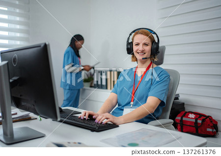 Nurse wearing headset smiling working call center 137261376
