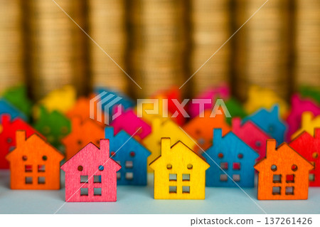 Colorful Wooden House Models with Coin Stacks Real Estate Finance Concept Colorful Wooden House Models with Coin Stacks Real Estate Finance Concept 137261426