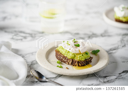 Avocado toast with poached egg Avocado toast with poached egg 137261585