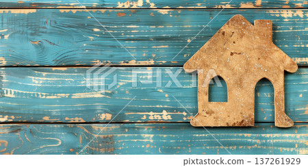 Wooden house silhouette on distressed blue wooden background for home theme 137261929