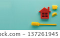 Creative house cleaning tools arranged on a turquoise background for home cleaning concept 137261945