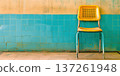 Bright yellow chair against turquoise wall in a clean, furnished room setting 137261948