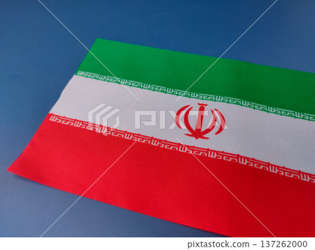 The image shows the national flag of Iran on a blue background. 137262000