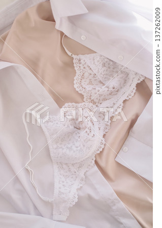 Woman's lingerie on the bed sheets. Lace sexy female underwear. Beauty, fashion blogger concept. Female bra, panties, erotic clothes. Lingerie advertising Woman's lingerie on the bed sheets. Lace sexy female underwear. Beauty, fashion blogger concept. Female bra, panties, erotic clothes. Lingerie advertising 137262009