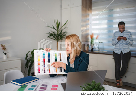 Creative fashion designers choosing colors for new collection Creative fashion designers choosing colors for new collection 137262034
