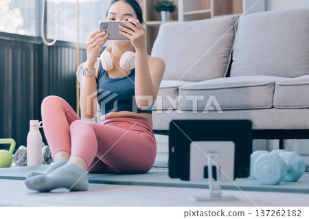 Young Asian sporty attractive people practicing yoga lesson with instructor. Asia group of women exercising healthy lifestyle in fitness studio. Sport activity, gymnastics or ballet dancing class. Young Asian sporty attractive people practicing yoga lesson with instructor. Asia group of women exercising healthy lifestyle in fitness studio. Sport activity, gymnastics or ballet dancing class. 137262182
