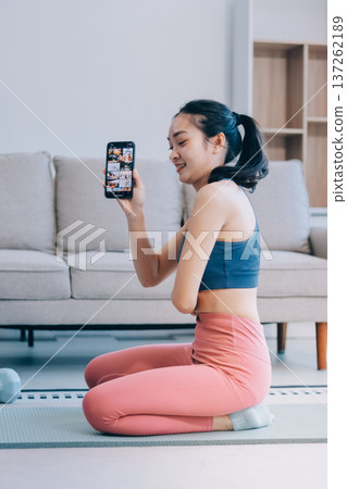 Young Asian sporty attractive people practicing yoga lesson with instructor. Asia group of women exercising healthy lifestyle in fitness studio. Sport activity, gymnastics or ballet dancing class. Young Asian sporty attractive people practicing yoga lesson with instructor. Asia group of women exercising healthy lifestyle in fitness studio. Sport activity, gymnastics or ballet dancing class. 137262189