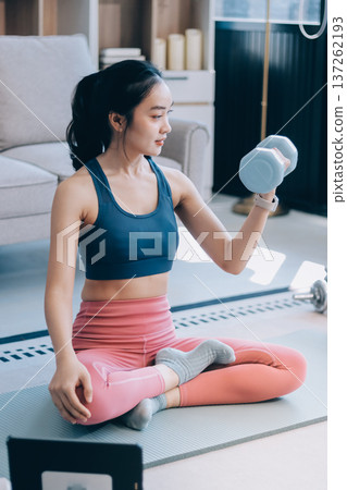 Young Asian sporty attractive people practicing yoga lesson with instructor. Asia group of women exercising healthy lifestyle in fitness studio. Sport activity, gymnastics or ballet dancing class. Young Asian sporty attractive people practicing yoga lesson with instructor. Asia group of women exercising healthy lifestyle in fitness studio. Sport activity, gymnastics or ballet dancing class. 137262193