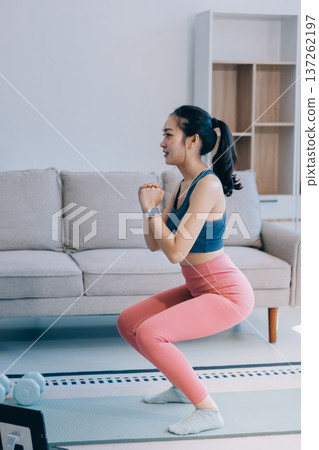 Young Asian sporty attractive people practicing yoga lesson with instructor. Asia group of women exercising healthy lifestyle in fitness studio. Sport activity, gymnastics or ballet dancing class. Young Asian sporty attractive people practicing yoga lesson with instructor. Asia group of women exercising healthy lifestyle in fitness studio. Sport activity, gymnastics or ballet dancing class. 137262197