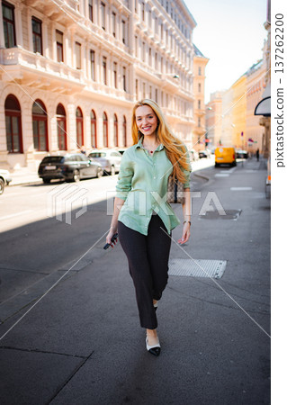 Young woman walking on urban street in Vienna, Austria 137262200