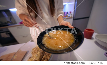 Creative filmmaker captures batter cascading into clear glass vessel Creative filmmaker captures batter cascading into clear glass vessel 137262463