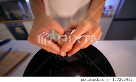 Preparing pastry in peaceful kitchen as sunlight filters through window 137262482