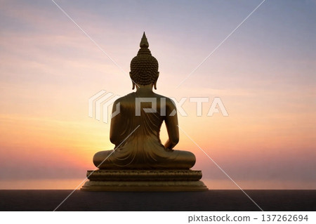 Golden Buddha Silhouette at Sunrise, Calm Spiritual Background for Editorial and Wellness Design 137262694