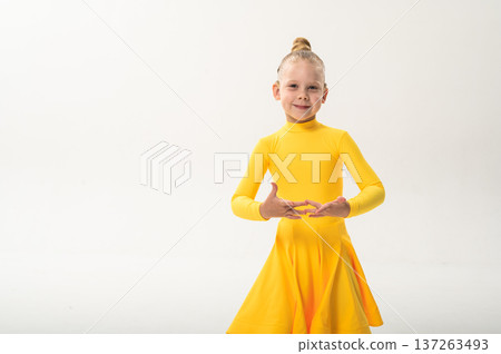 Close-up portrait of child with cochlear implant during dance practice. Copy space. Hearing loss treatment, auditory rehabilitation, assistive medical technology, emotional adaptation, and inclusive 137263493