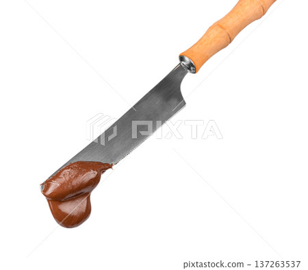 Knife with Chocolate Spread Isolated on Light Background Knife with Chocolate Spread Isolated on Light Background 137263537
