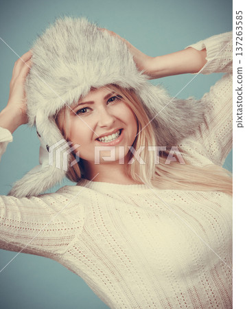Blonde woman in winter furry hat 137263585