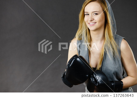 Boxer girl exercise with boxing gloves. Boxer girl exercise with boxing gloves. 137263643