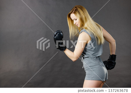 Boxer girl exercise with boxing gloves. Boxer girl exercise with boxing gloves. 137263678