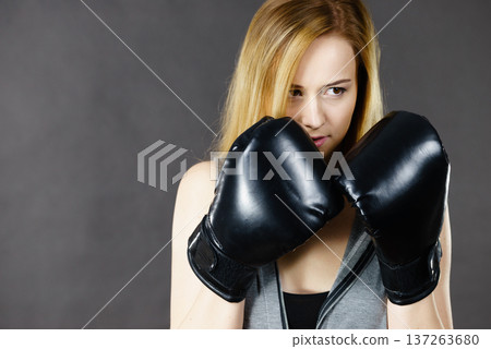 Boxer girl exercise with boxing gloves. Boxer girl exercise with boxing gloves. 137263680