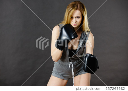 Boxer girl exercise with boxing gloves. Boxer girl exercise with boxing gloves. 137263682