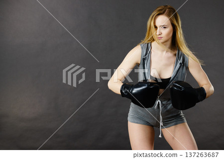 Boxer girl exercise with boxing gloves. Boxer girl exercise with boxing gloves. 137263687