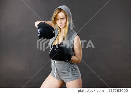 Boxer girl exercise with boxing gloves. Boxer girl exercise with boxing gloves. 137263690