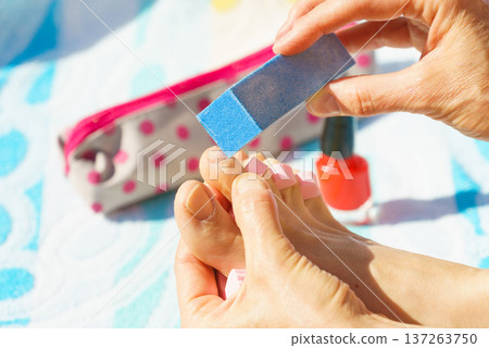 Woman pedicure outdoor Woman pedicure outdoor 137263750