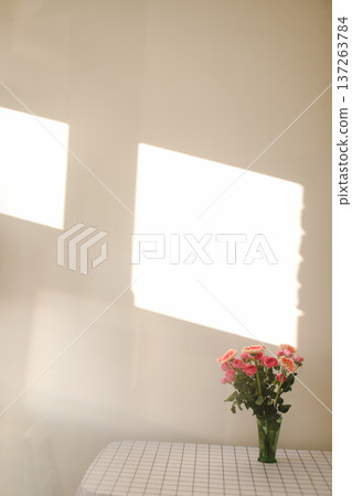 flowers in a vase. Home decoration and interior. Details of still life in the home interior of living room. Cozy spring concept. flowers in a vase. Home decoration and interior. Details of still life in the home interior of living room. Cozy spring concept. 137263784