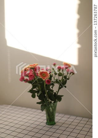 flowers in a vase. Home decoration and interior. Details of still life in the home interior of living room. Cozy spring concept.  137263787