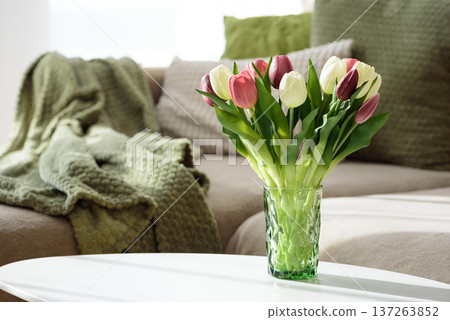 Living Room Decorated Spring Tulip Bouquet in Green Vase. Cozy Home Decor Arrangement Living Room Decorated Spring Tulip Bouquet in Green Vase. Cozy Home Decor Arrangement 137263852