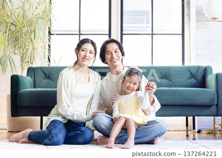 A family relaxing in the living room 137264221