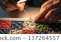 Hands Embroidery Craftsmanship with Needle and Thread. 137264557